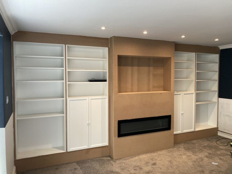Full-width media wall with fireplace and storage